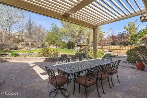 a patio with water view and outdoor space