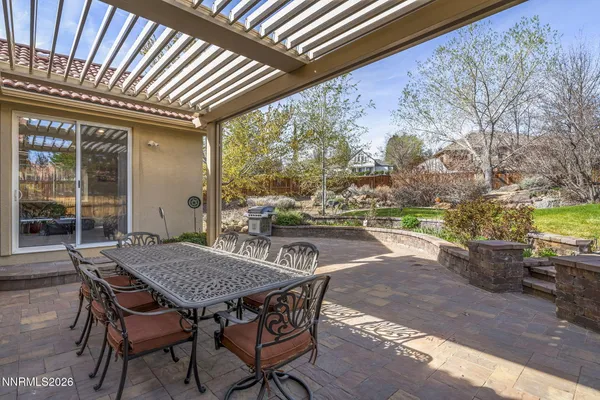 a patio with water view and wooden floor