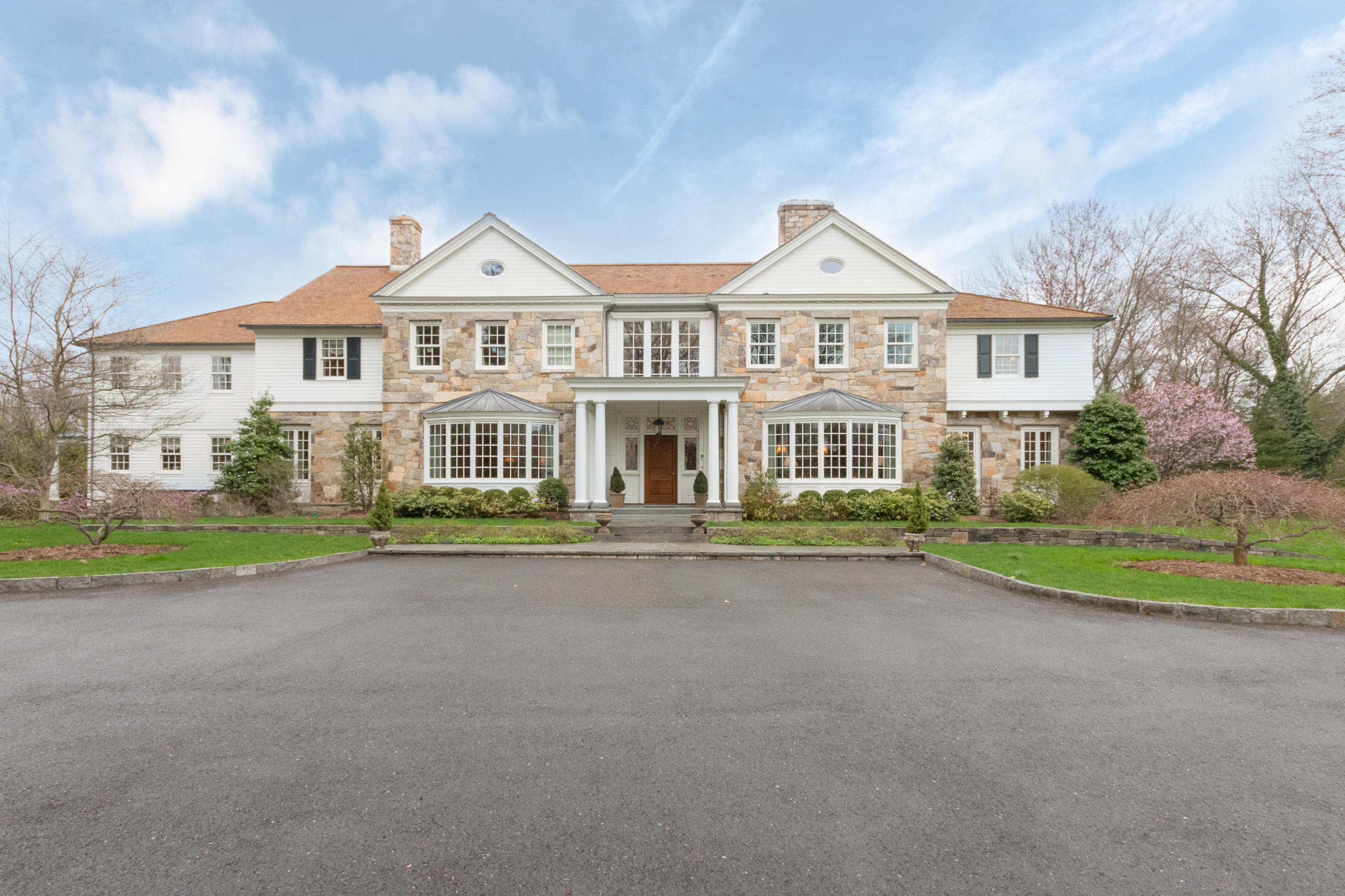 300 Brookside Road Darien, CT 06820 - Photo 1 of 41 a front view of a house with a yard and garage