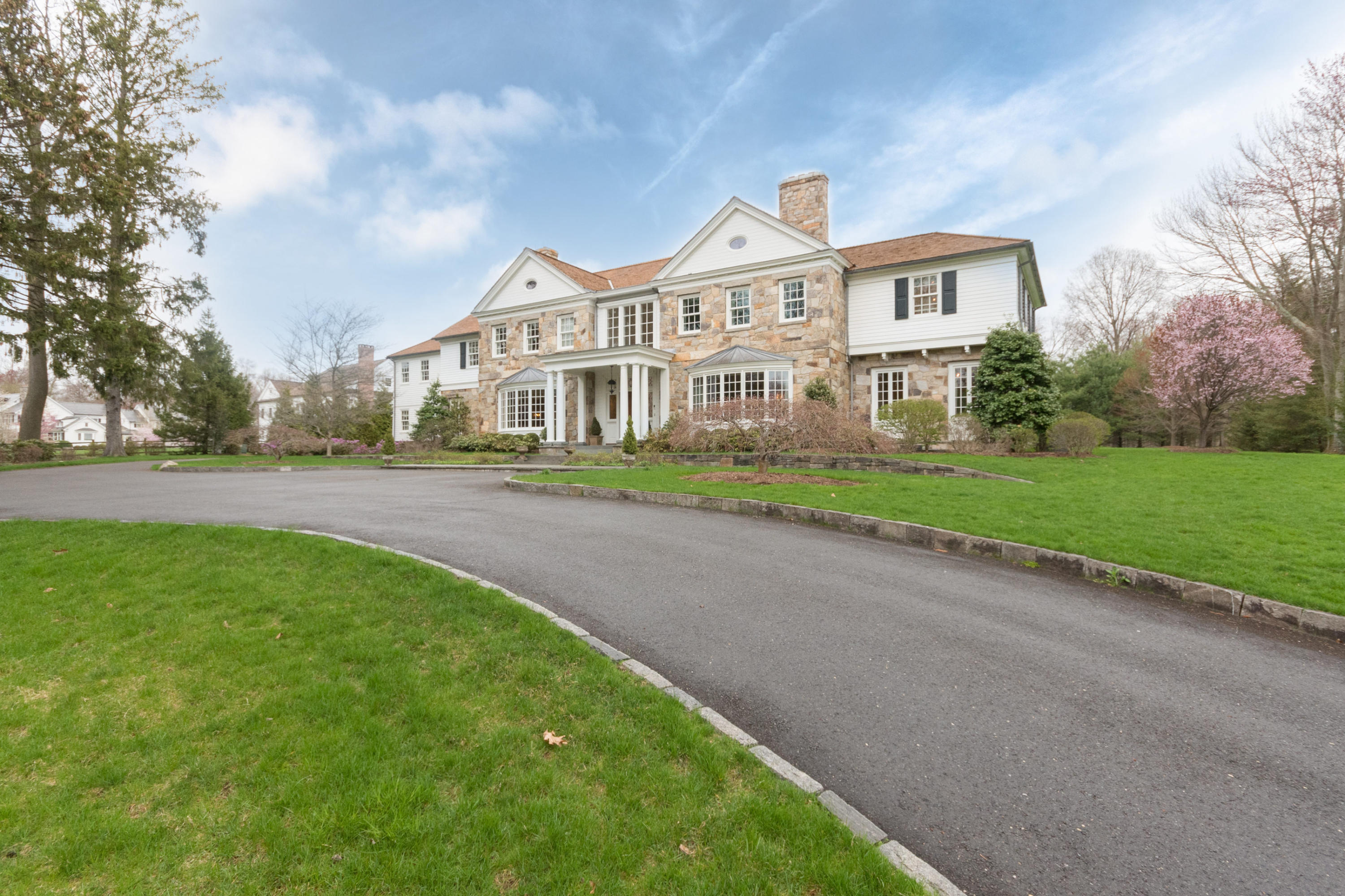 300 Brookside Road Darien, CT 06820 - Photo 4 of 41 a front view of a house with a yard and trees