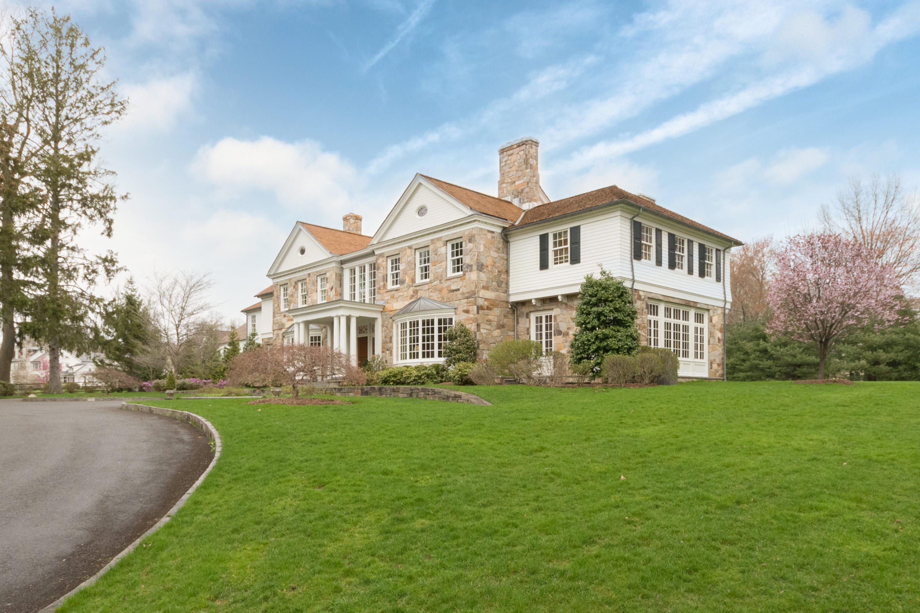 300 Brookside Road Darien, CT 06820 - Photo 5 of 41 a front view of a house with a garden