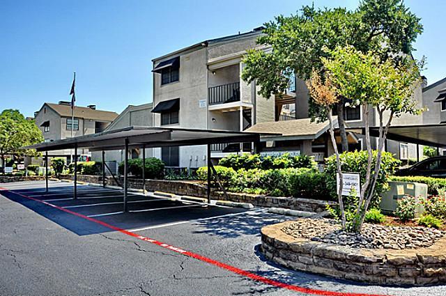 6910 Skillman Street, Unit 2016 Dallas, TX 75231 - Photo 11 of 23 a front view of a building with trees