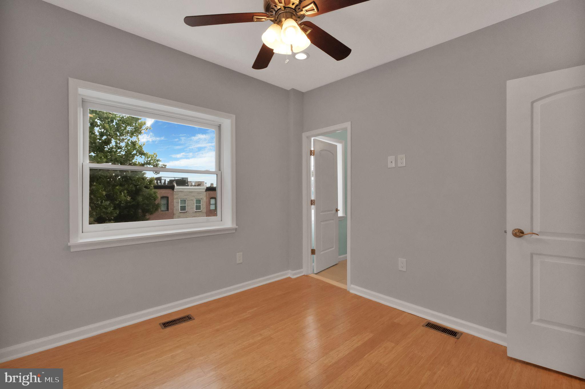 245 South Clinton Street Baltimore, MD 21224 - Photo 20 of 39 a view of an empty room with a window