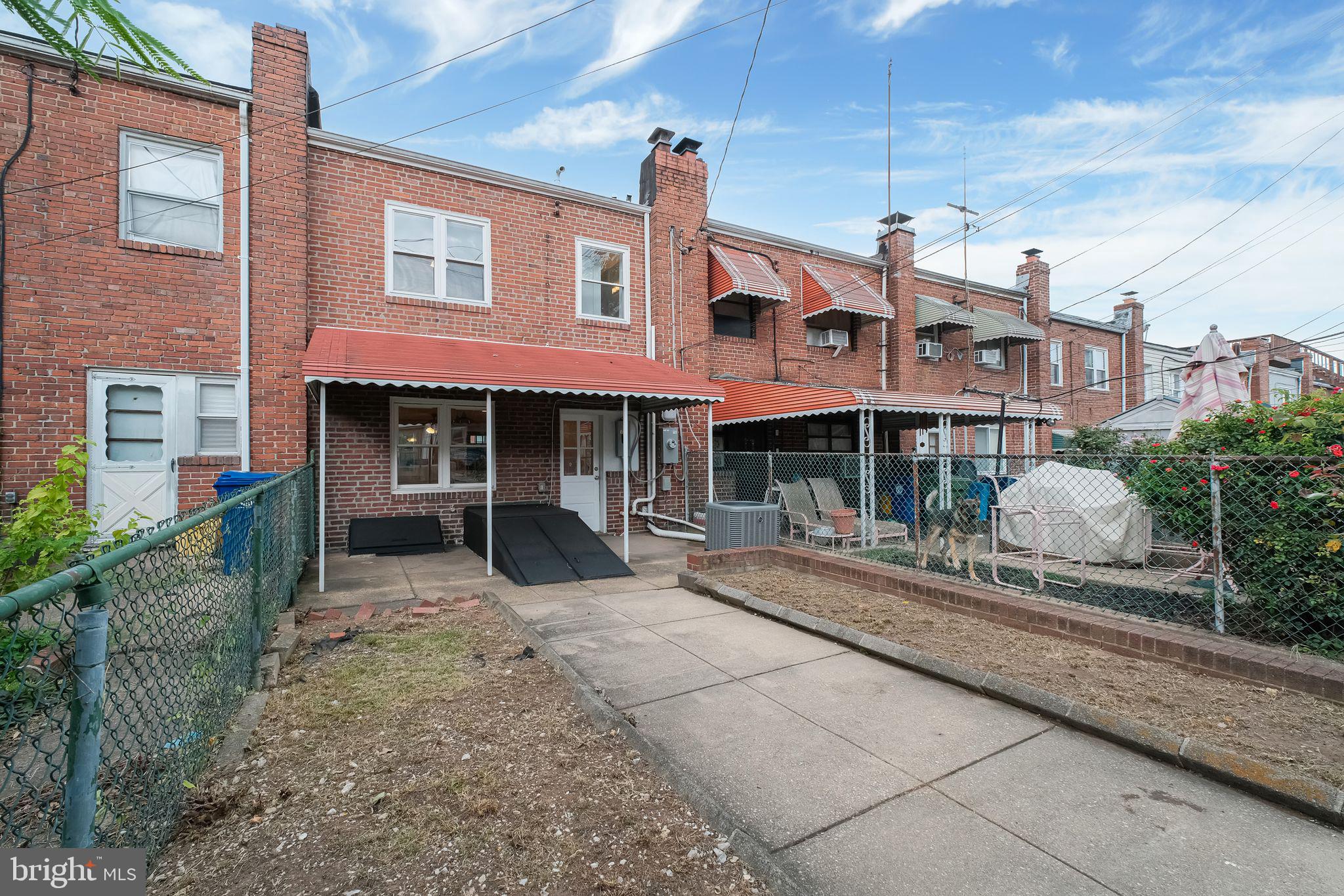 245 South Clinton Street Baltimore, MD 21224 - Photo 31 of 39 a front view of a building with sitting area