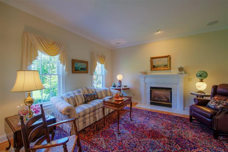 84 Farm Valley Road Osterville, MA 02655 - Photo 5 of 30 a living room with furniture and a fireplace