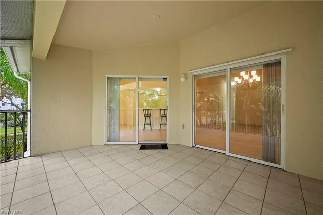 a bed sitting in a room next to a window
