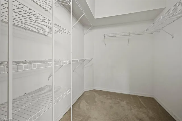 a room with a bed and a window