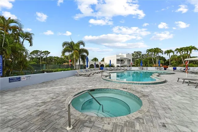 an aerial view of a yard with swimming pool and mountains