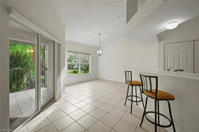 a view of a livingroom with furniture wooden floor and window
