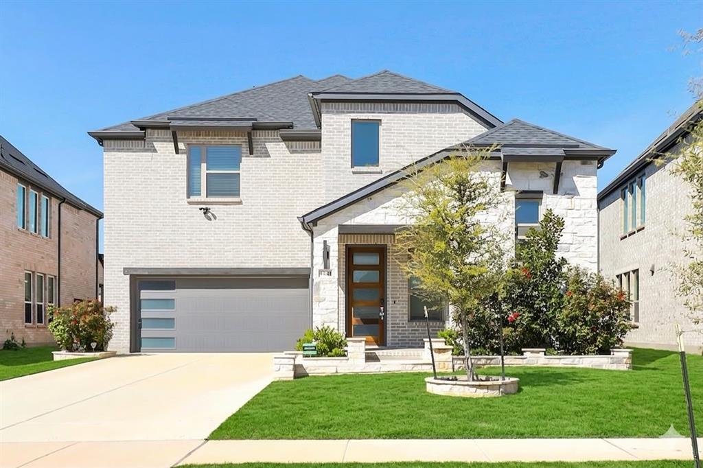 1241 Lupine Road Prosper, TX 75078 - Photo 1 of 38 Contemporary two-story residence featuring light brick and stone veneer