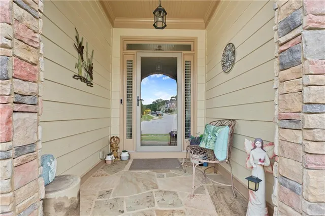 a front view of a house with outdoor seating space