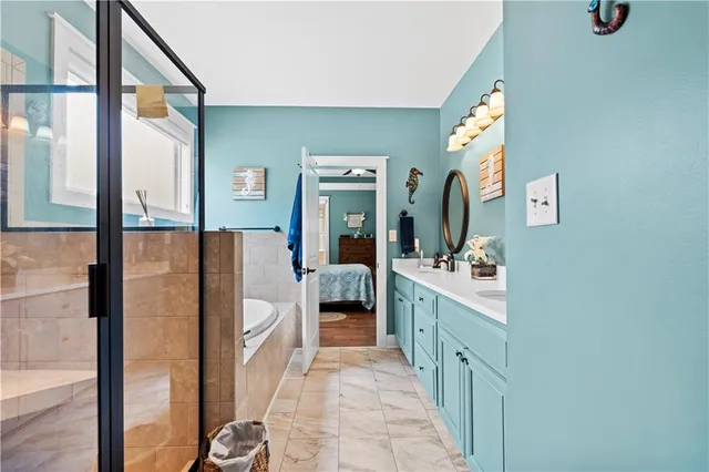 a bathroom with a double vanity sink and mirror