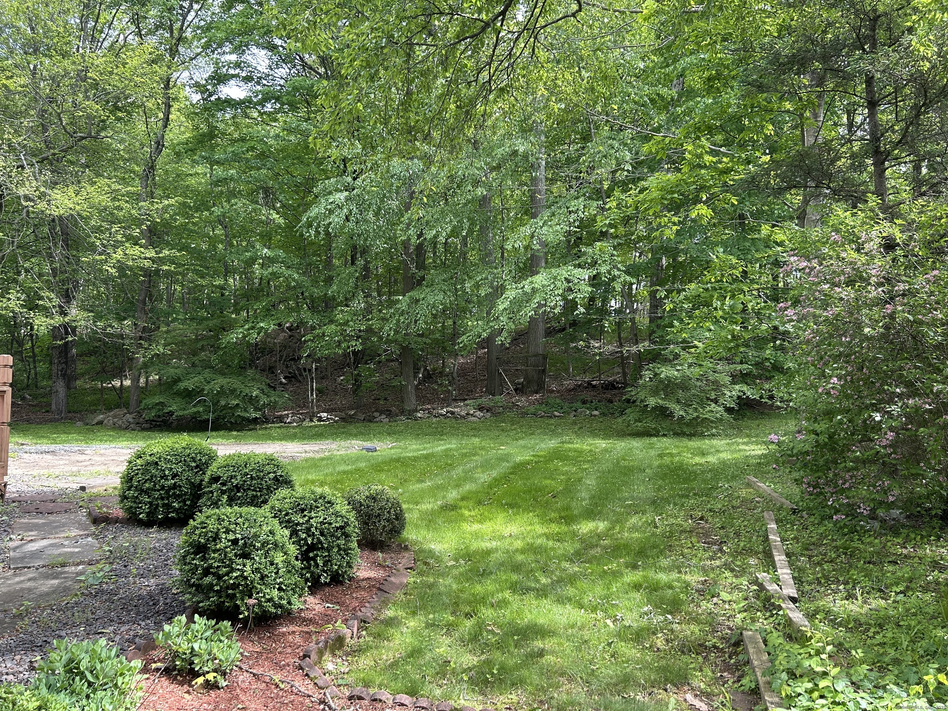 14 Aspen Ledges Road Ridgefield, CT 06877 - Photo 3 of 19 a view of backyard with green space