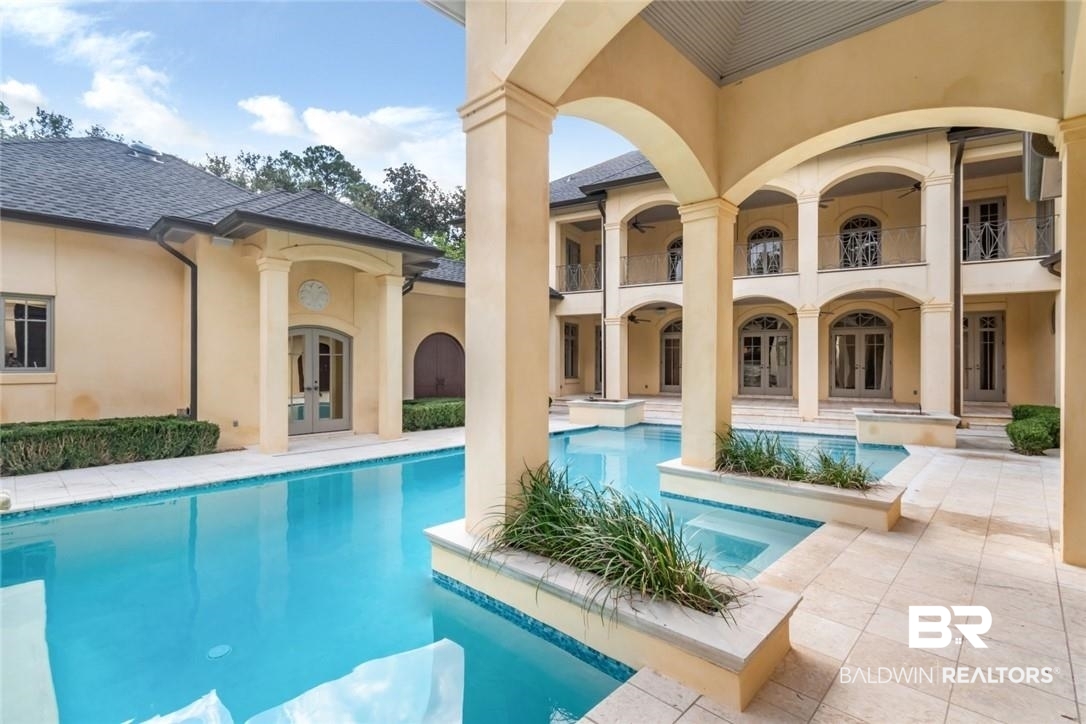 4 Chancery Court Mobile, AL 36608 - Photo 44 of 54 View of swimming pool featuring french doors and a patio area