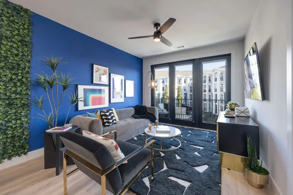 a living room with furniture and a large window