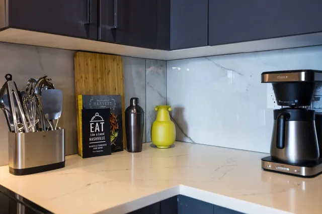 a kitchen with sink and refrigerator