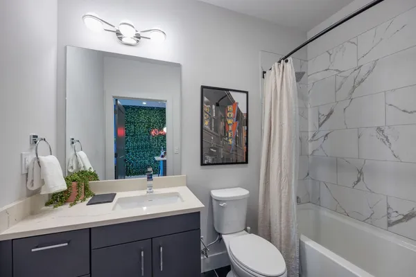 a view of a livingroom with furniture and a window