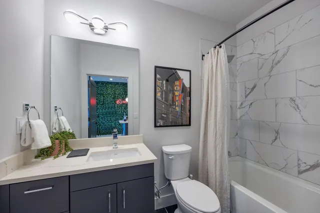 a view of a livingroom with furniture and a window