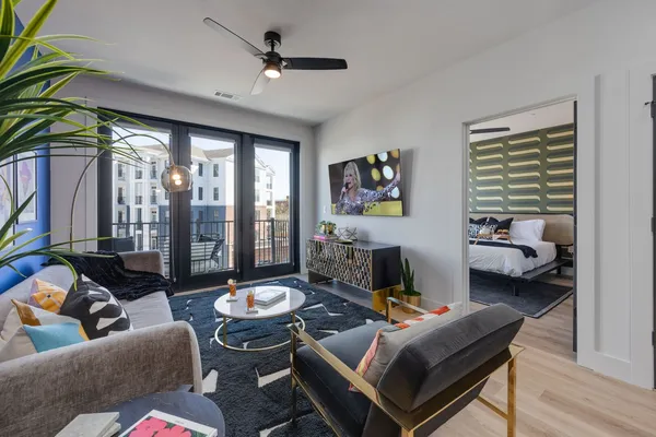 a living room with furniture and a large window