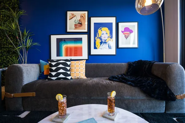 a living room with furniture flowerpot and window