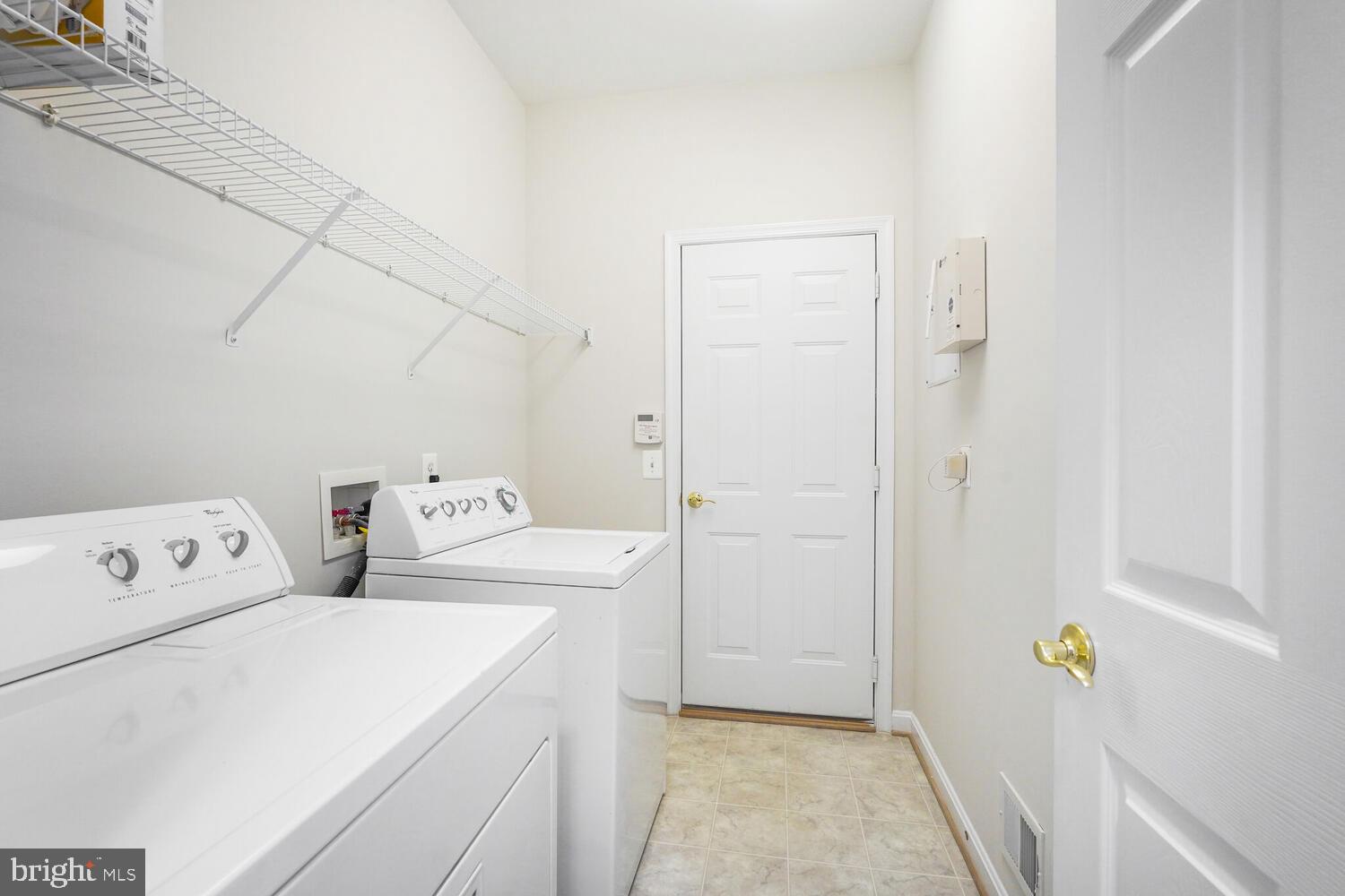 3948 Solstice Lane Dumfries, VA 22025 - Photo 16 of 27 a utility room with dryer and washer