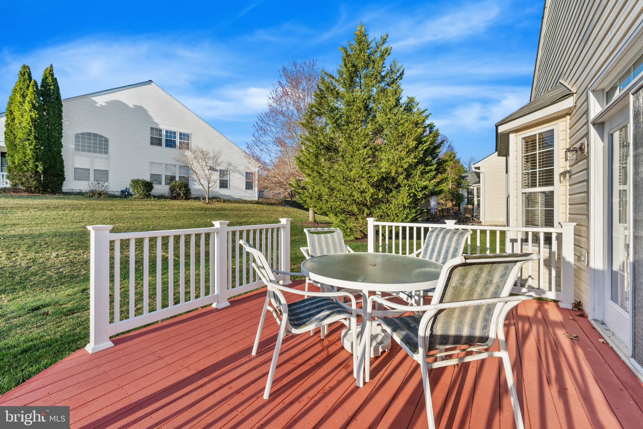 3948 Solstice Lane Dumfries, VA 22025 - Photo 17 of 27 a view of a house with wooden deck and furniture