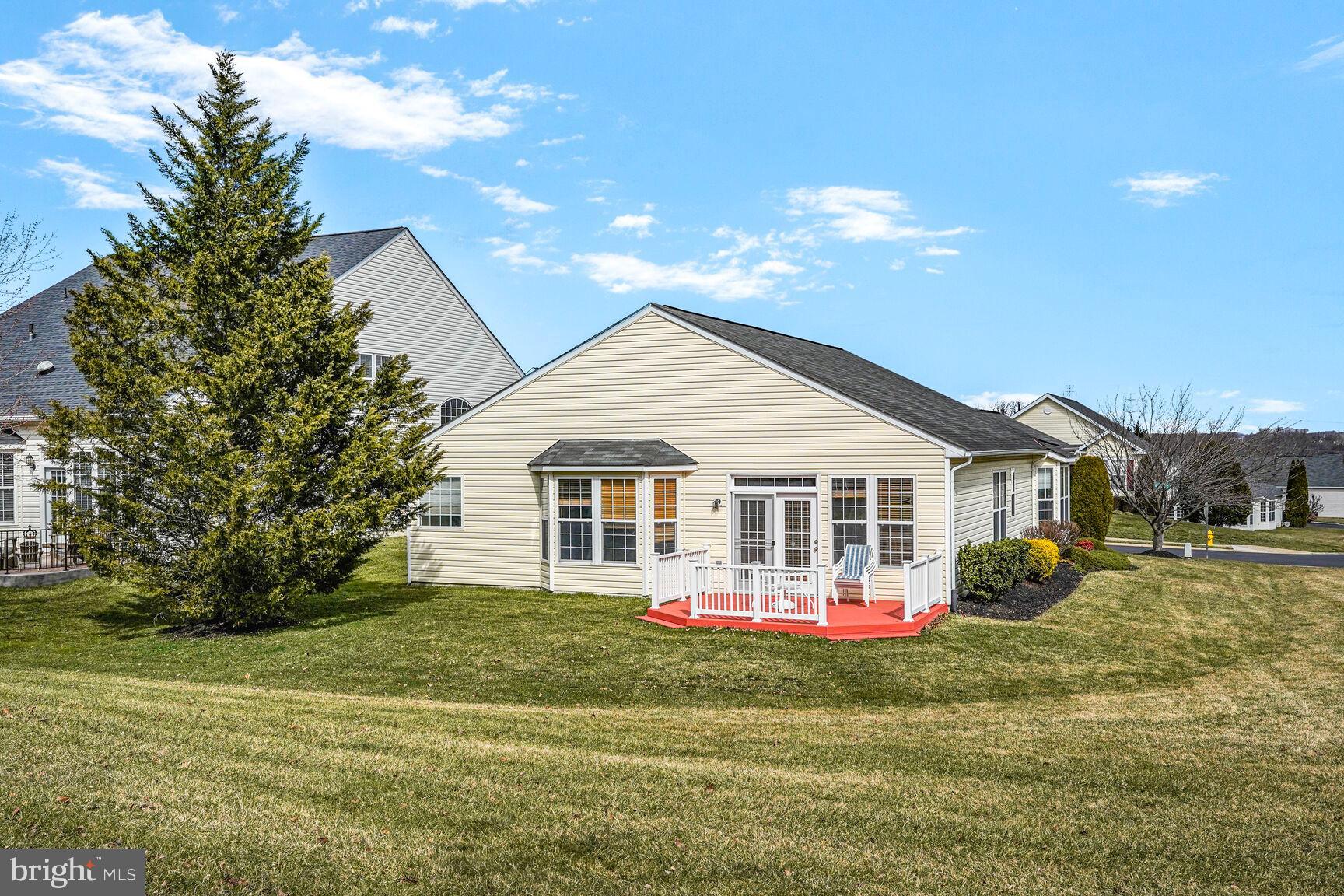 3948 Solstice Lane Dumfries, VA 22025 - Photo 2 of 27 a view of a white house with a yard and potted plants