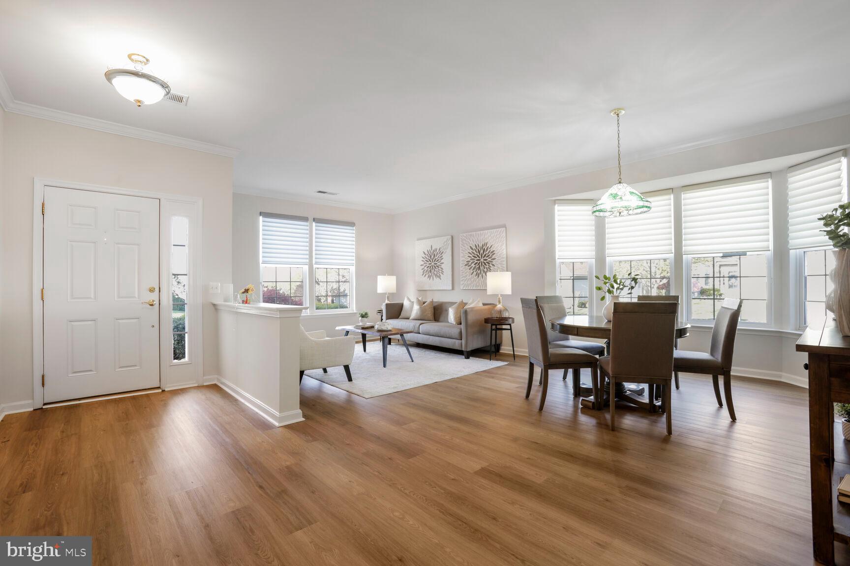 3948 Solstice Lane Dumfries, VA 22025 - Photo 3 of 27 a view of a dining room with furniture window and wooden floor