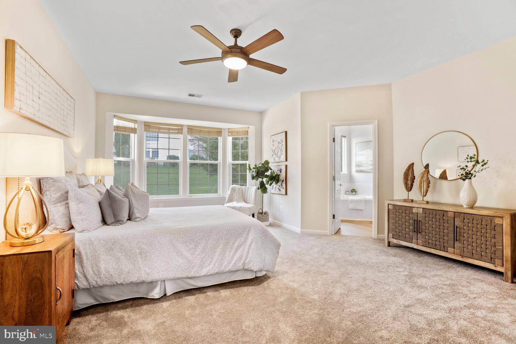 3948 Solstice Lane Dumfries, VA 22025 - Photo 10 of 27 a bedroom with a bed a large window with outer view