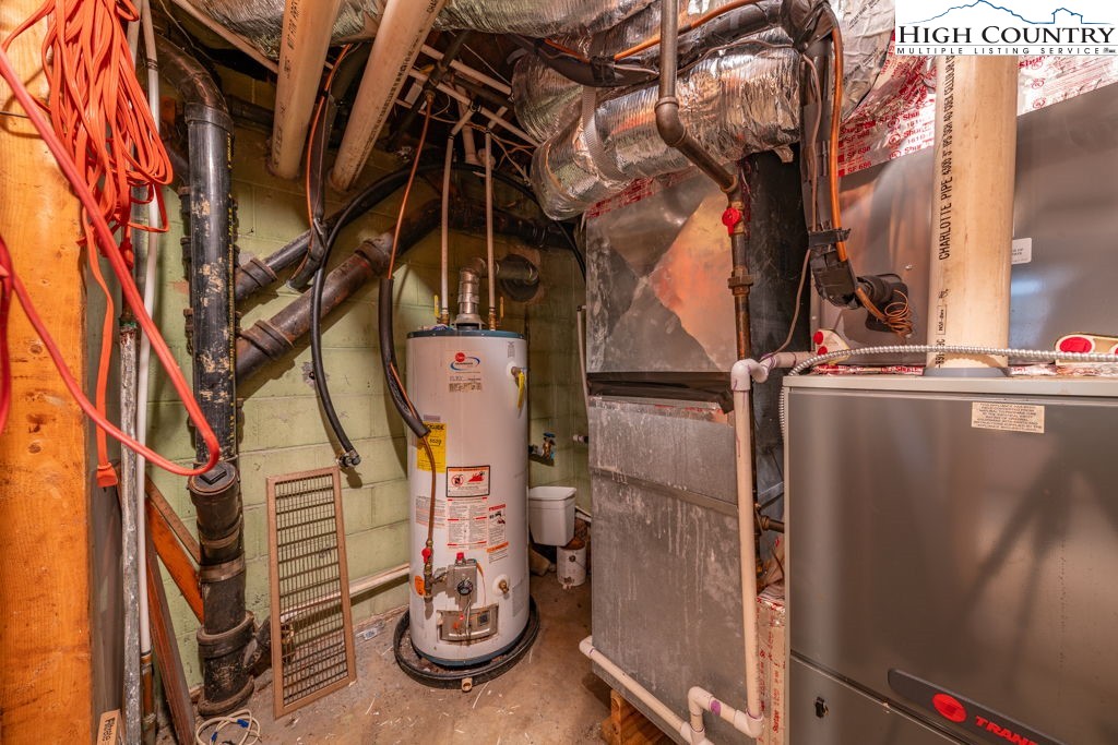 881 Queen Street Boone, NC 28607 - Photo 35 of 43 a view of walk in closet with clothes and shoes