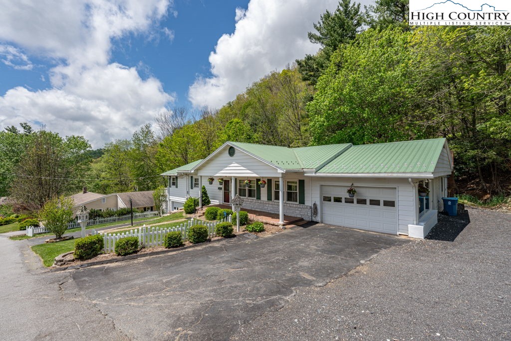 881 Queen Street Boone, NC 28607 - Photo 39 of 43 an aerial view of a house with a garden