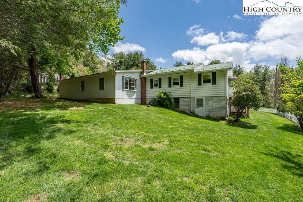 881 Queen Street Boone, NC 28607 - Photo 4 of 43 a front view of a house with garden