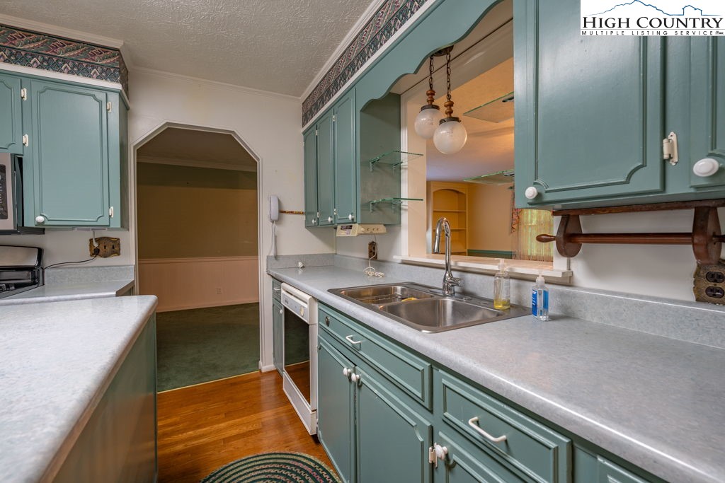 881 Queen Street Boone, NC 28607 - Photo 6 of 43 a kitchen with a sink and a refrigerator