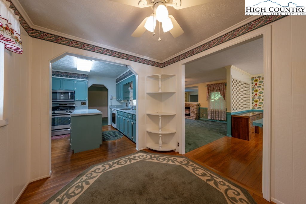881 Queen Street Boone, NC 28607 - Photo 7 of 43 a living room with furniture and a chandelier