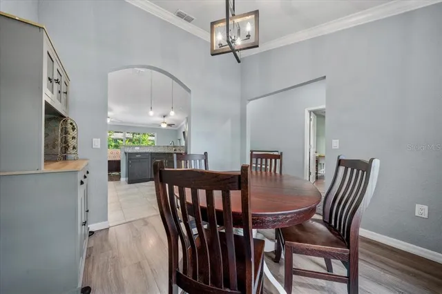 a workspace with wooden floor and a window