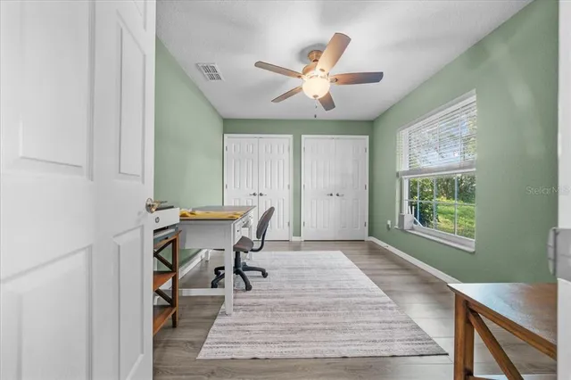 a workspace with furniture and wooden floor