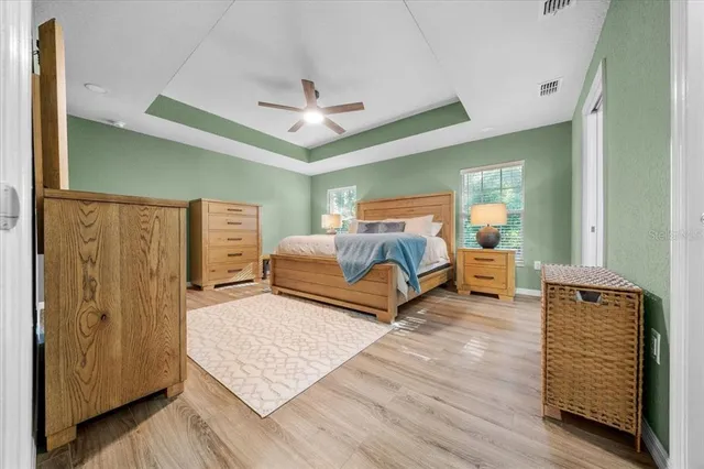 a spacious bedroom with a bed and a walk in closet