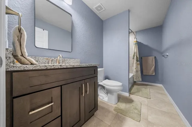 a bathroom with a sink and shower