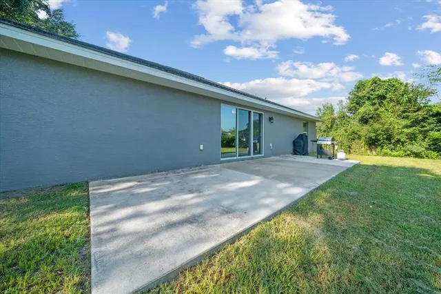 a view of a backyard of the house