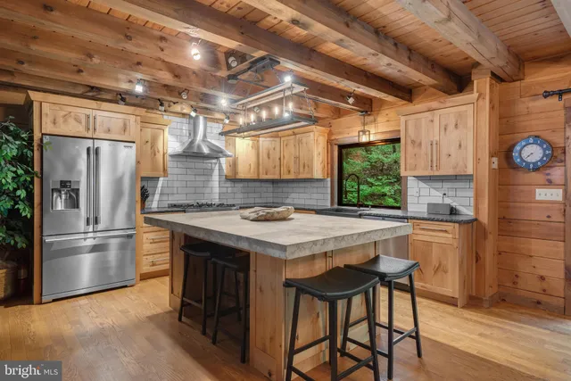 a kitchen with a table and chairs