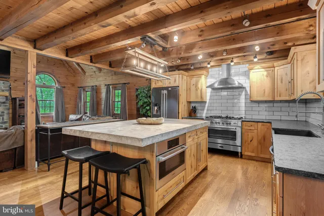 a kitchen with a stove and cabinets