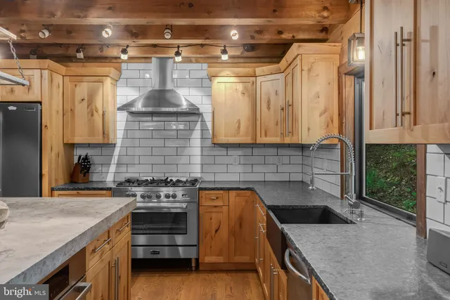 a kitchen with a stove and a refrigerator