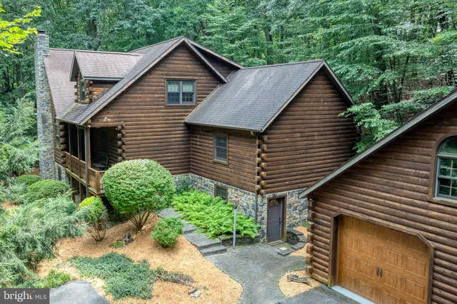a backyard of a house with potted plants