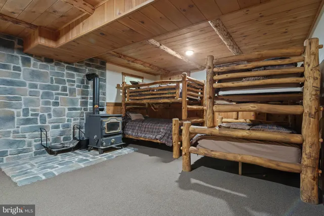 a view of a wooden bridge with large trees