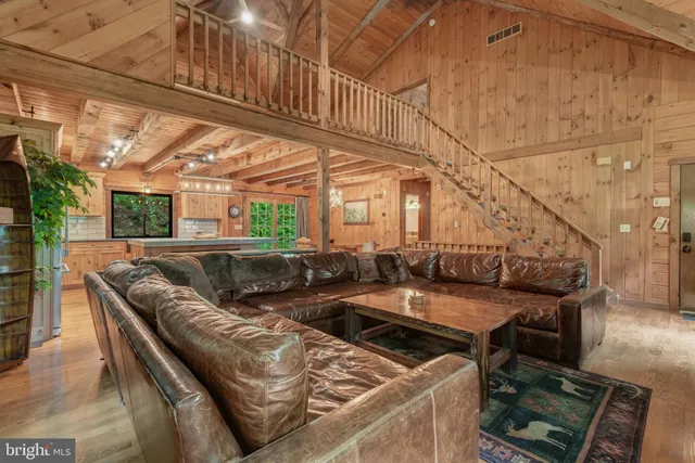 a view of a couches and table in the balcony