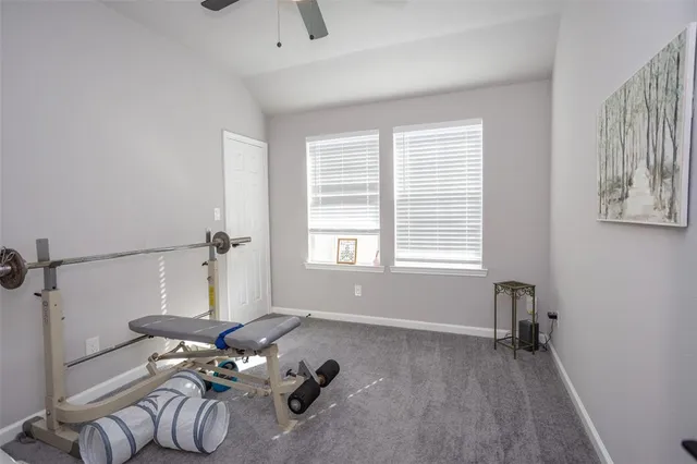 a view of a livingroom with furniture and a window