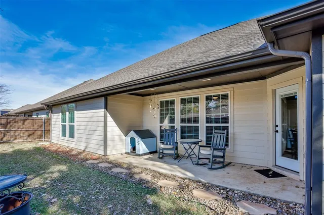 a backyard of a house with seating space