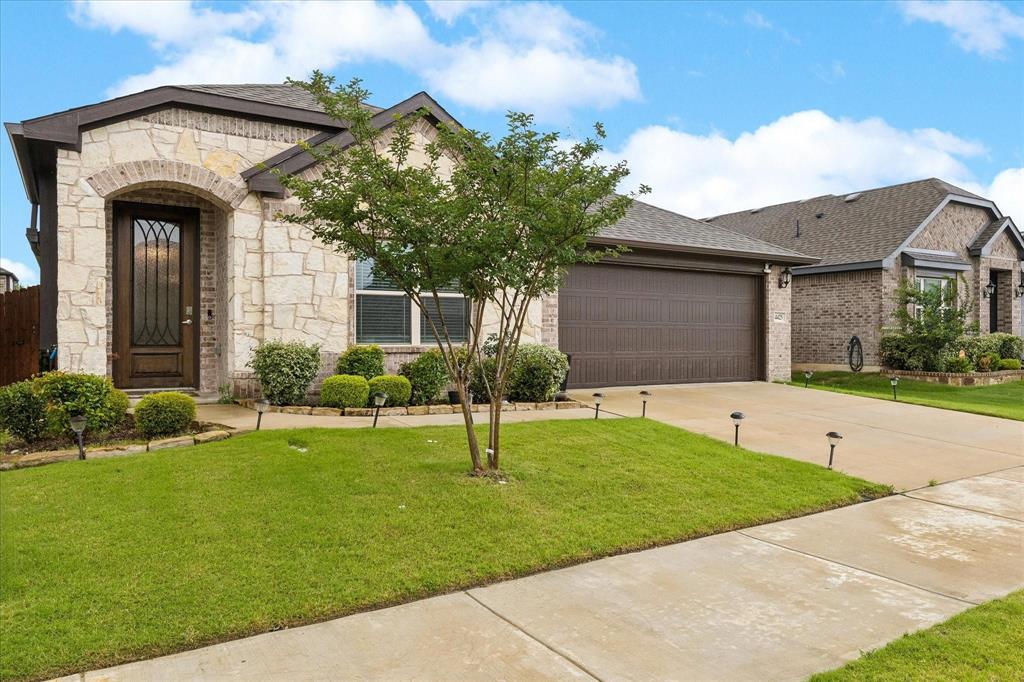 4425 Ridgehurst Lane Crowley, TX 76036 - Photo 1 of 1 Stone and brick facade with an arched entry