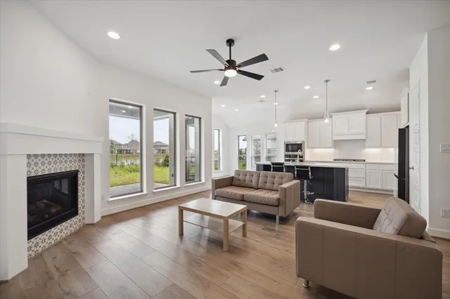 a living room with furniture and a fireplace