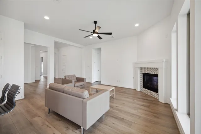 a living room with furniture and a fireplace